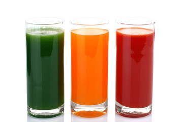 Fresh vegetable juices isolated on white