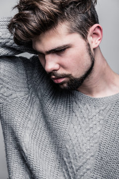 Portrait Of A Young Man In Gray Pullover