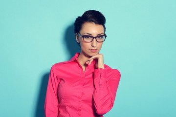 attractive cheerful young woman in glasses