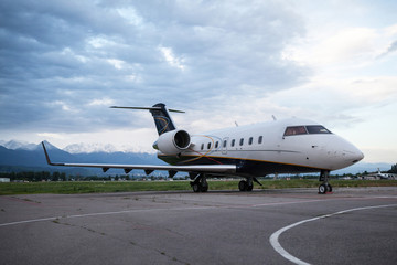 Business jet airplane on the ground. Early morning.