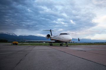 Fototapeta na wymiar Business jet airplane on the ground. Early morning.