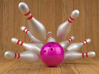 Pink bowling ball and scattered skittles on wood