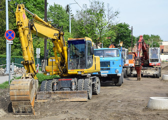 Excavators and truck at the road construction