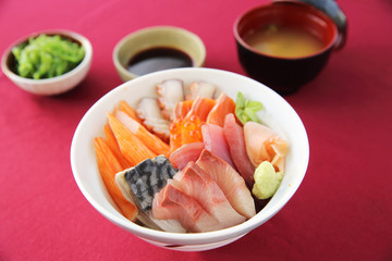 Sushi don , raw salmon tuna octopus on rice