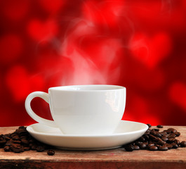 Hot coffee with red heart background