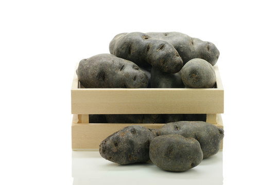 Vitolette noir or purple potato in a box / crate