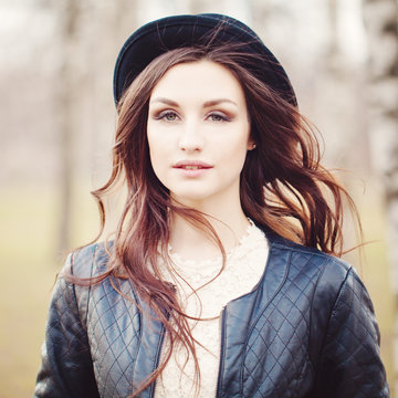 Attractive Girl in Park. Makeup, Curly Hair, Hipster hat