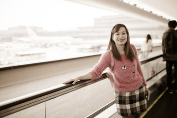 Portrait of a young woman in the boarding bridge