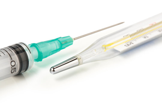 Medical equipment : thermometer and syringe isolated