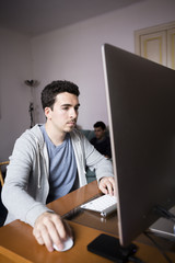 Students with Computer near the windows at home