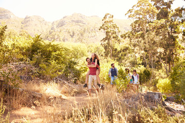 Group Of Friends On Walk Through Countryside Together