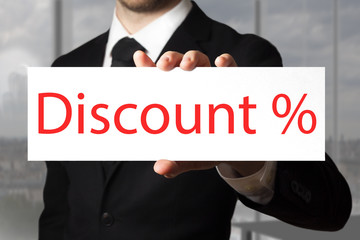 businessman pointing on sign discount percentage symbol