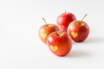 Red apples with a heart symbol