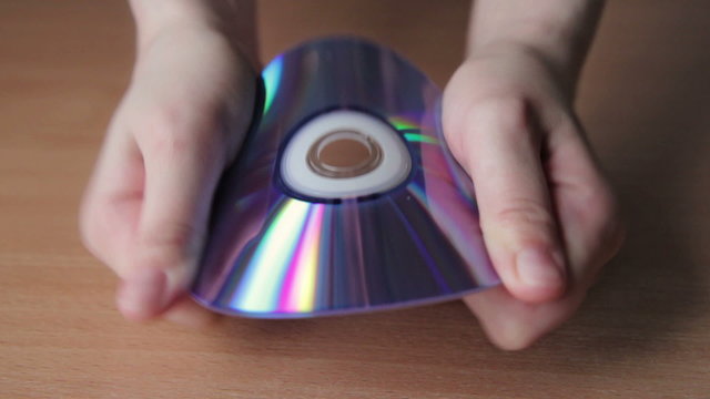 Young Woman Breaking CD, DVD