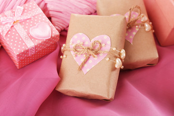 Handmade gifts on Valentine Day, on fabric background