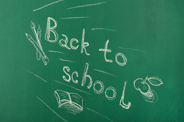 Back to school written with chalk on blackboard