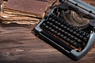 Old retro typewriter on table close-up