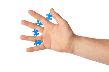 Hand and puzzle