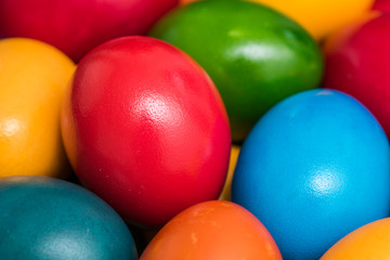 Fototapeta na wymiar Colorful Easter Eggs In Basket Close Up