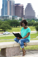 African American woman reading a  book, Austin, Texas 