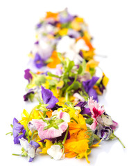 Mix edible flower salad in a blue single pot