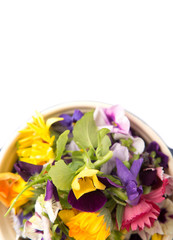 Mix edible flower salad in a blue single pot