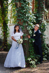 Bride and Groom at wedding Day walking Outdoors on spring nature