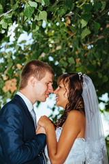 Bride and Groom at wedding Day walking Outdoors on spring nature