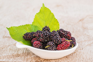 Mulberries with leaf isolated on white background