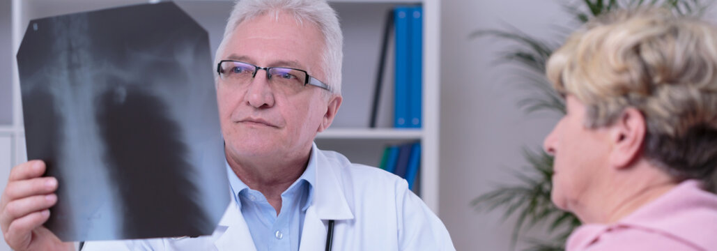 Medic looking at chest x-ray