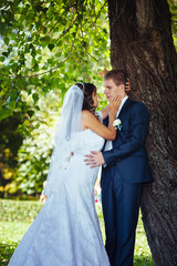 Bride and Groom at wedding Day walking Outdoors on spring nature