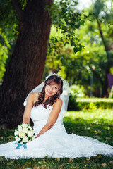 Portrait of a beautiful smiling bride posing in her wedding day