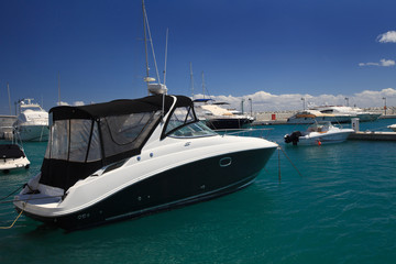 Fototapeta premium Small pleasure yacht in the harbor close-up 