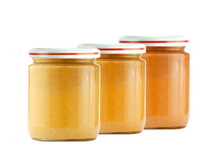 Jars of baby puree isolated on white