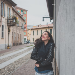 Beautiful girl posing in the city streets