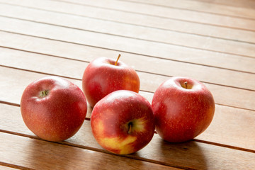 Apples on wooden background