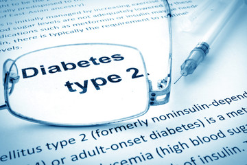Paper with words diabetes type 2 and glasses.