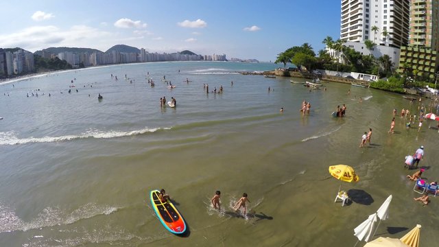 People surf and doing stand up in a Beach in Brazil