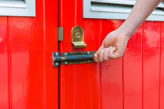 Hand Opening Little Red Door