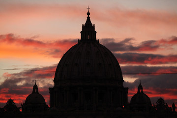 Sunset over the dome of Saint Peter's Basilica in Vatican City i