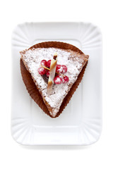 piece of cake with berries. on white. top view