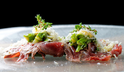 Beef carpaccio appetizer with baby asparagus and Parmesan 