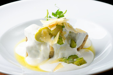 Slices of tasty corn polenta with asparagus, cheese table