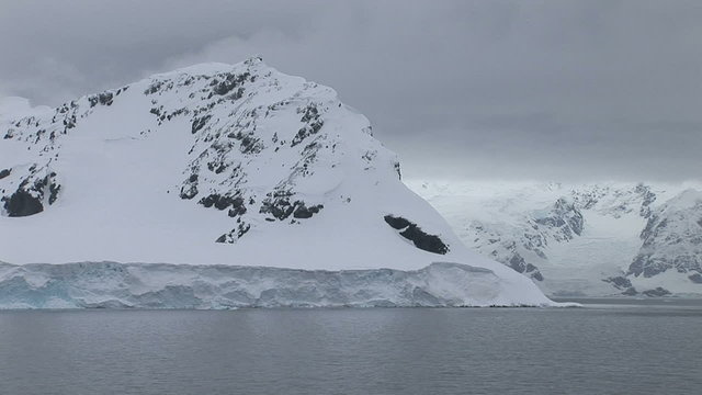 Sailing pass pretty scenery in Paradise Harbour, Antarctica
