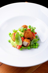 Fried Octopus on basil mousse, green peas and fresh strawberries