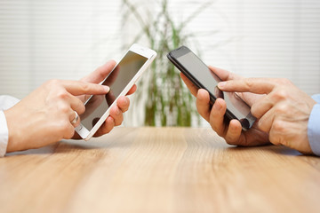 woman and man using applications together on mobile smart phone