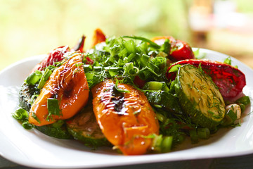 dish with grilled sweet peppers, zucchini, green onions and herb