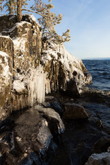 Frozen lakefront rock cliff 