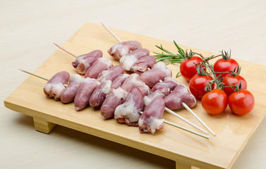 Raw chicken hearts for barbecue