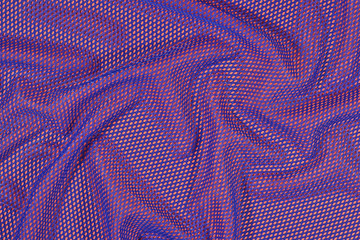 Blue crumpled nonwoven fabric on a orange